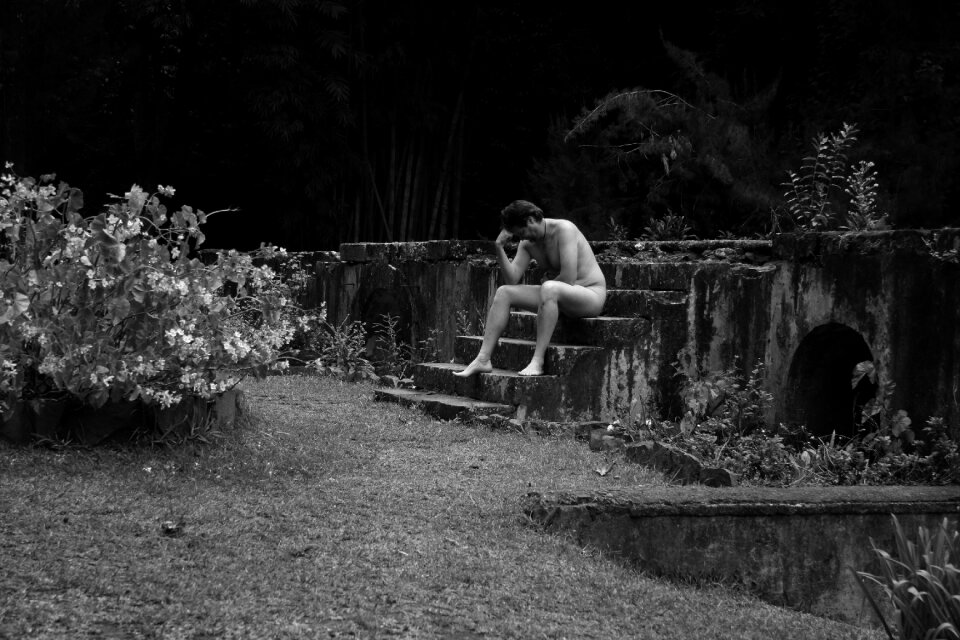 Stone staircase thinker by rodin naked man
