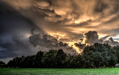 Clouds trees green photo