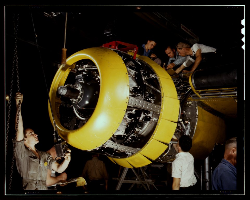 Mounting motor [on a] Fairfax B-25 bomber, at North American Aviation, Inc., plant in [Inglewood], Calif, 1942, Alfred Palmer