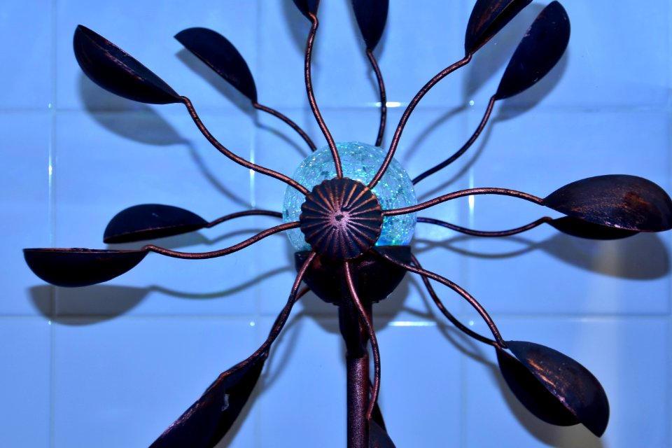 Impatient son holding Wind Spinner in Kitchen - bulb
