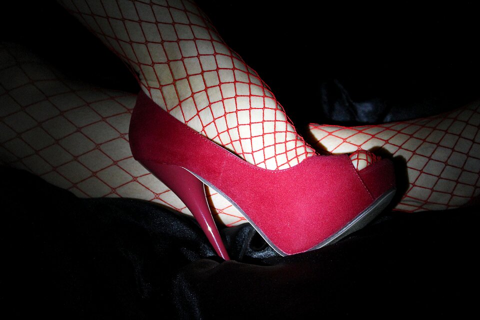 Red fishnet stocking erotic