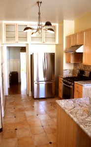Huge High-end Kitchen with custom granite, tile and lighting