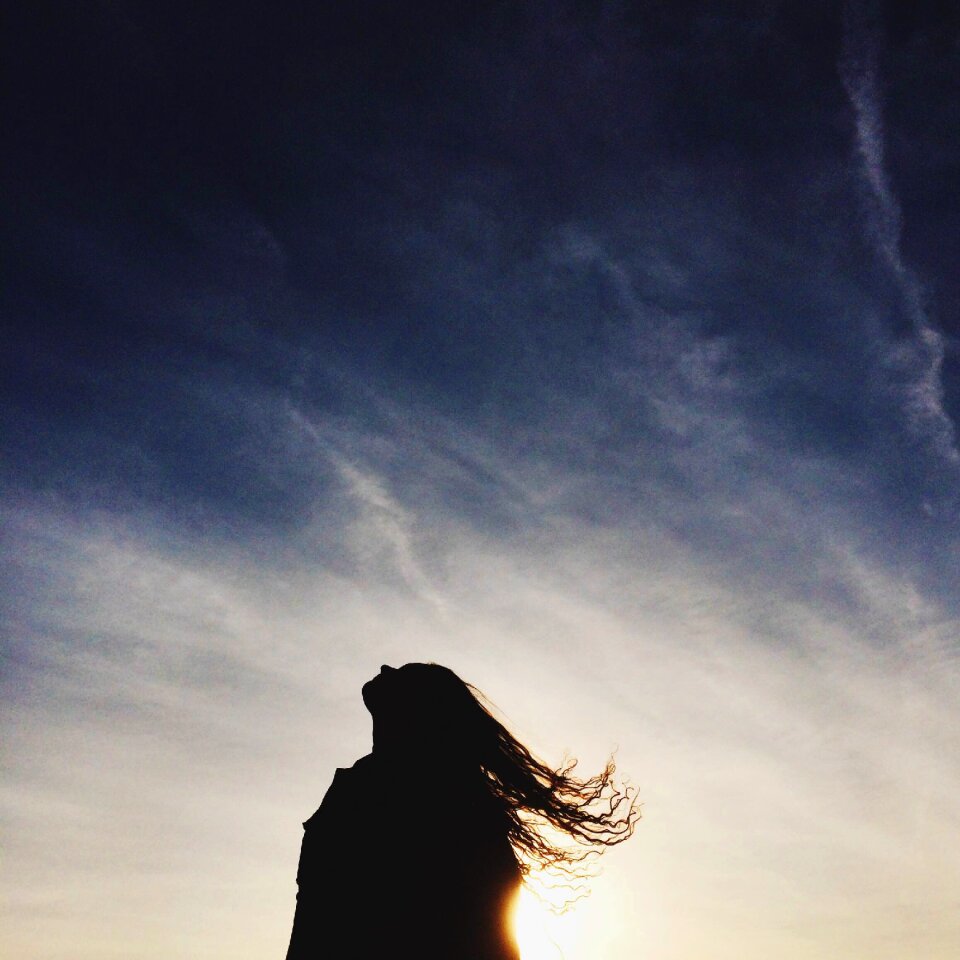 Long hair woman sky