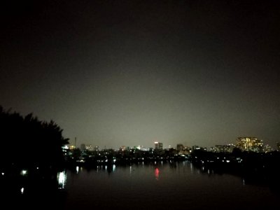 cycling at night, him lam bridge, district 7, saigon, vietnam, night river