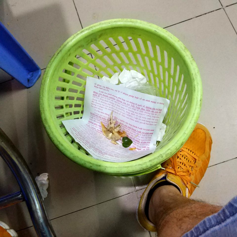 propaganda in garbage bin