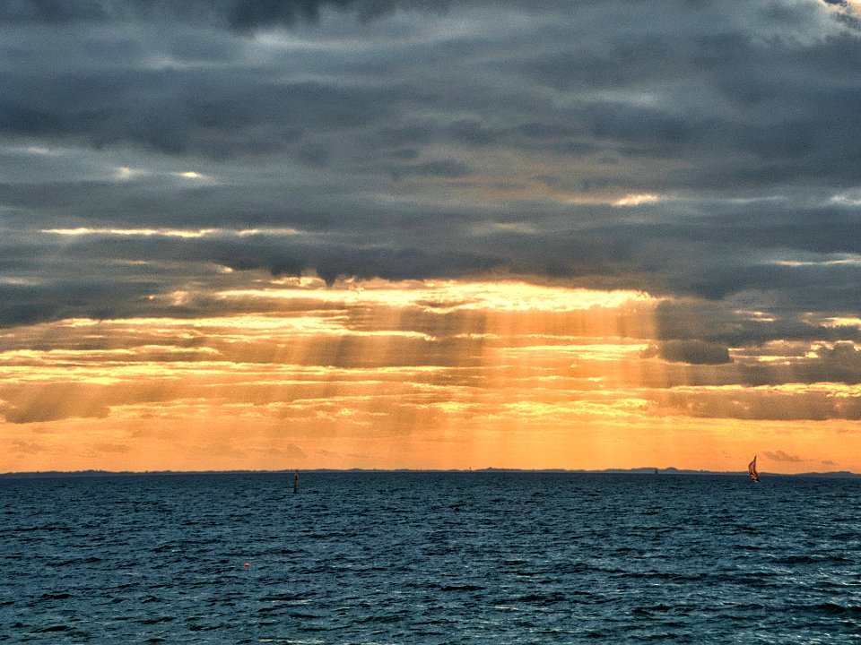 Red sail in the sunset