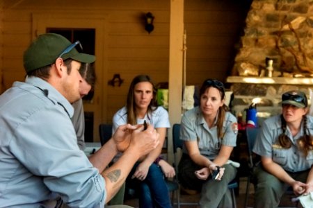 Park staff learning flintknapping techniques