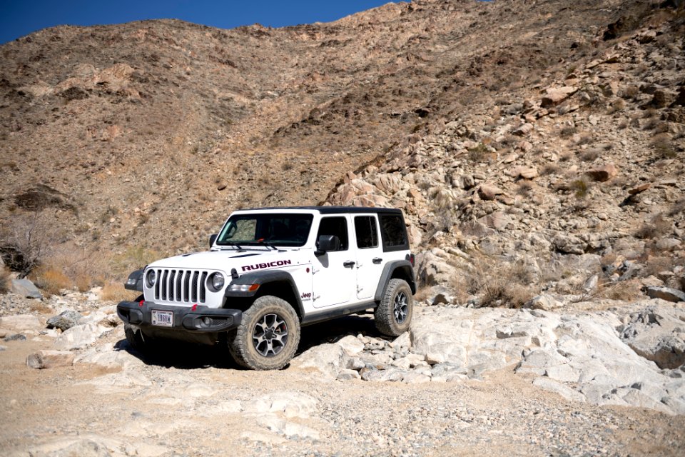 Jeep navigating a rock waterfall on Pinkham Canyon Road