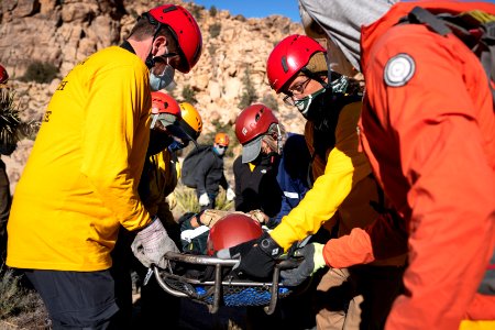 Joshua Tree Search and Rescue team members training carrying a litter photo