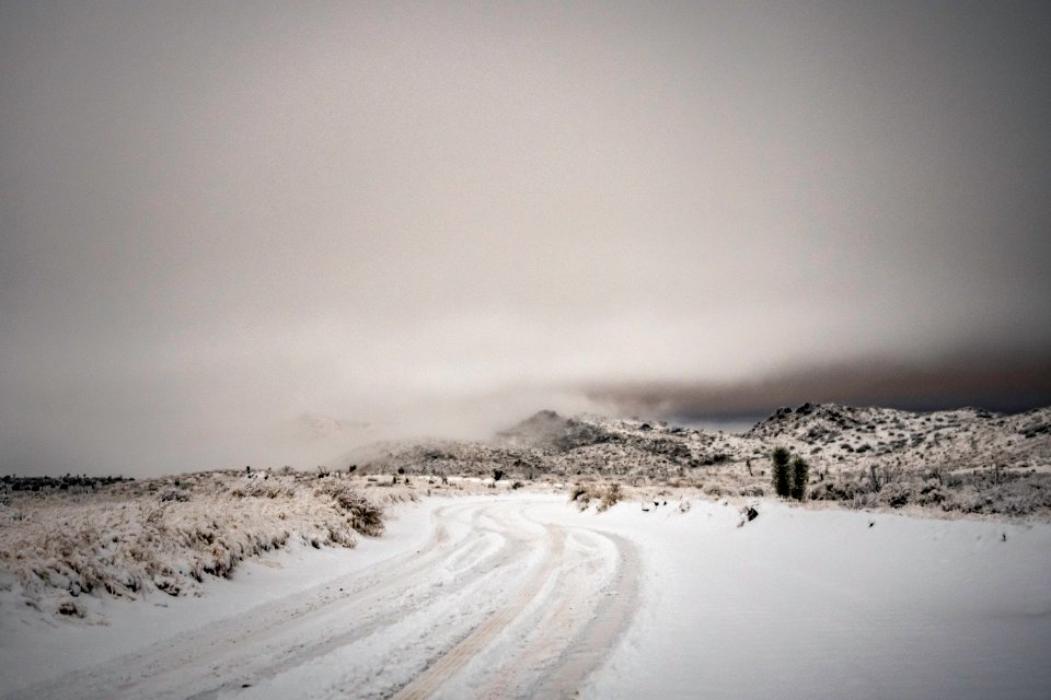 Mist over snow-covered mountains at Covington Flats