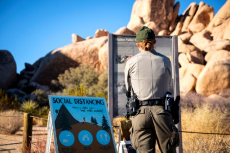 Park Ranger reading signs at the Real Hidden Valley Trail