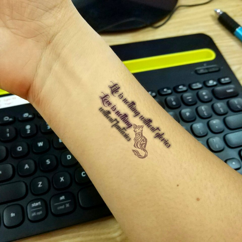 virtual tattoo text: Life is nothing without glories, Love is nothing without fantasies made by Tattoo Name On My Photo Editor app
