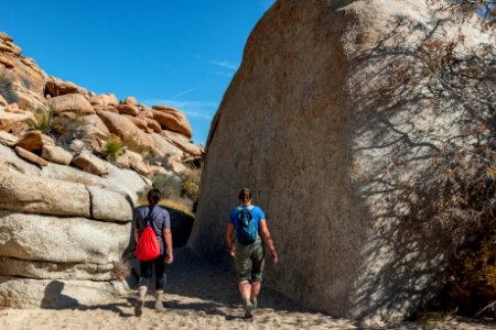 Tall boulder and hikers on Willow Hole trail