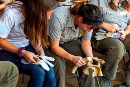 Park staff learning flintknapping techniques