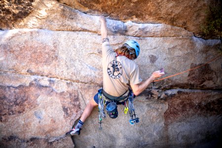 Climber steward placing gear at Gunsmoke photo