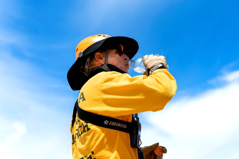Joshua Tree Search and Rescue member drinking water