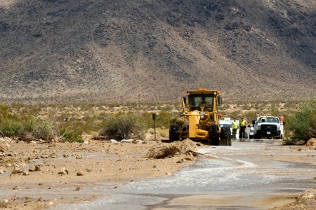 Removing debris from road after flooding, 8/26/15 (near North Entrance)