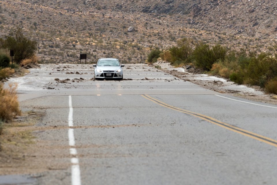 A visitor drives through water on the road; 8/26/15