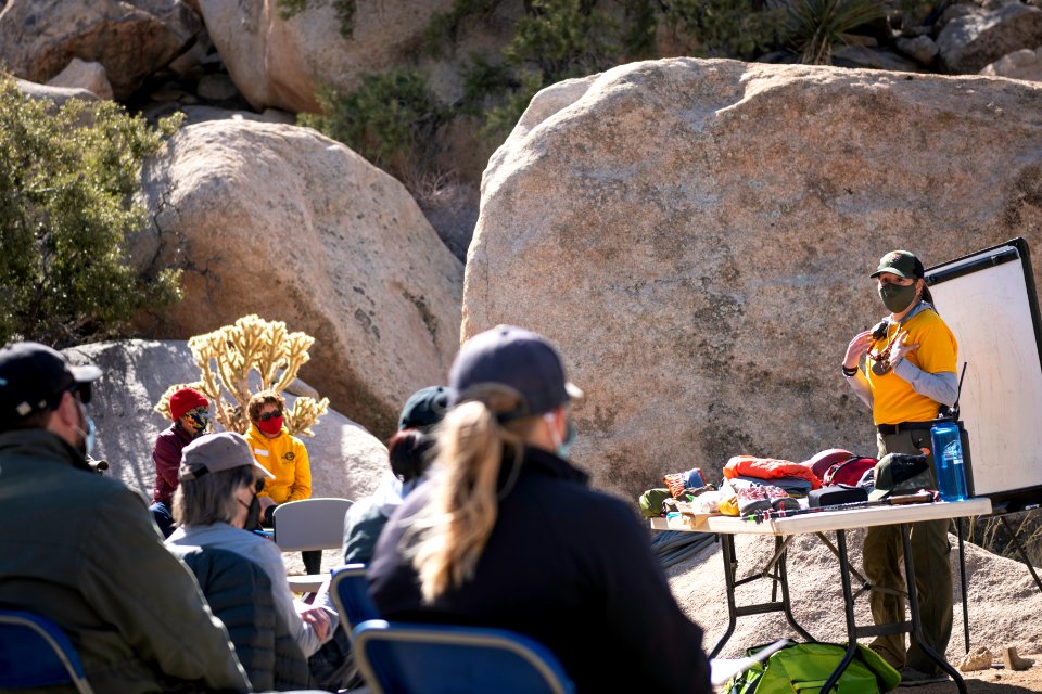 Joshua Tree Search and Rescue team members discussing pack items photo