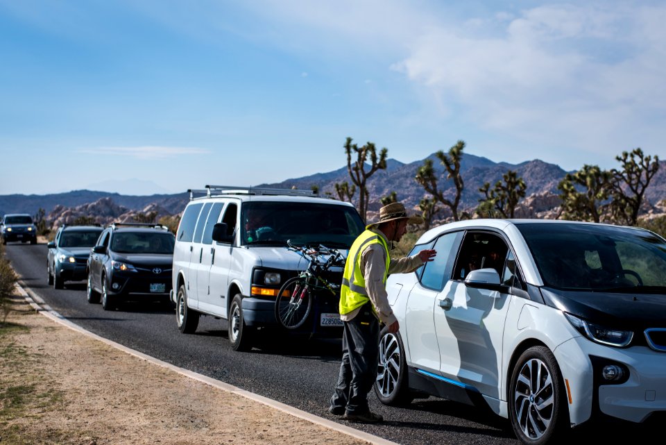 Peak operations staff with line of cars