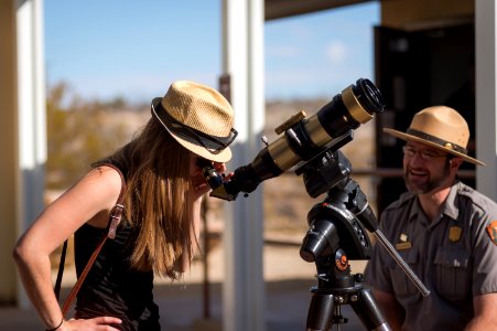 Ranger Robb Hannawacker Helps a Visitor Use a Solar Telescope to Safely Observe the Sun photo