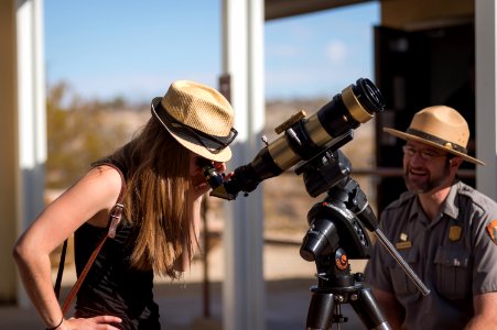 Ranger Robb Hannawacker Helps a Visitor Use a Solar Telescope to Safely Observe the Sun