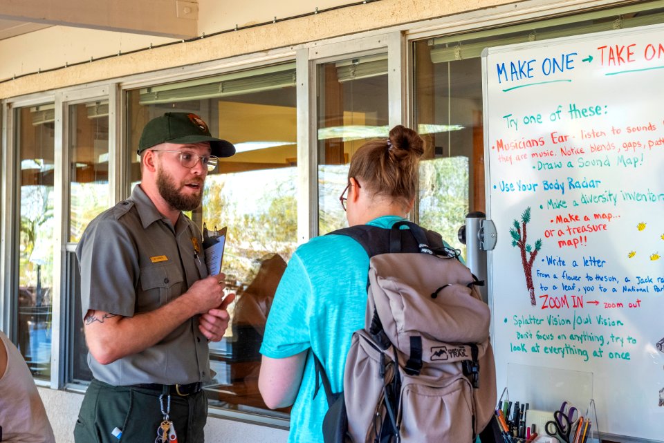 Park ranger talking to visitors at Oasis of Mara Visitor Center