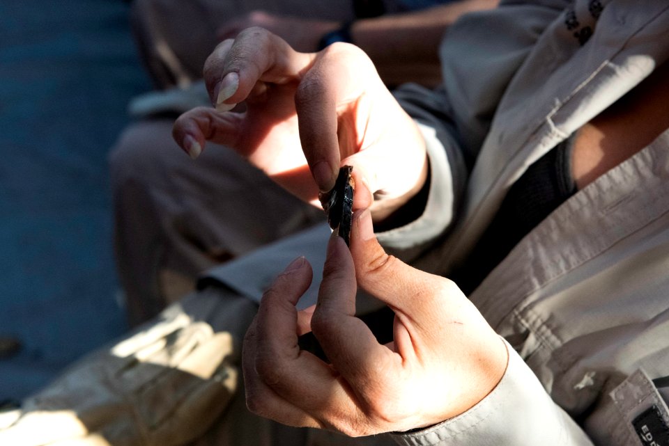 Park staff learning flintknapping techniques