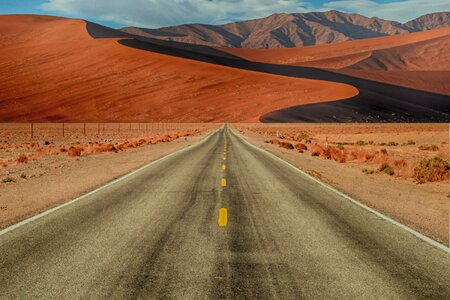 Mountains straight road desert road