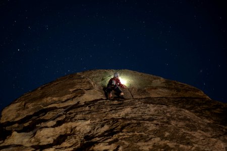 Climber with headlamp photo