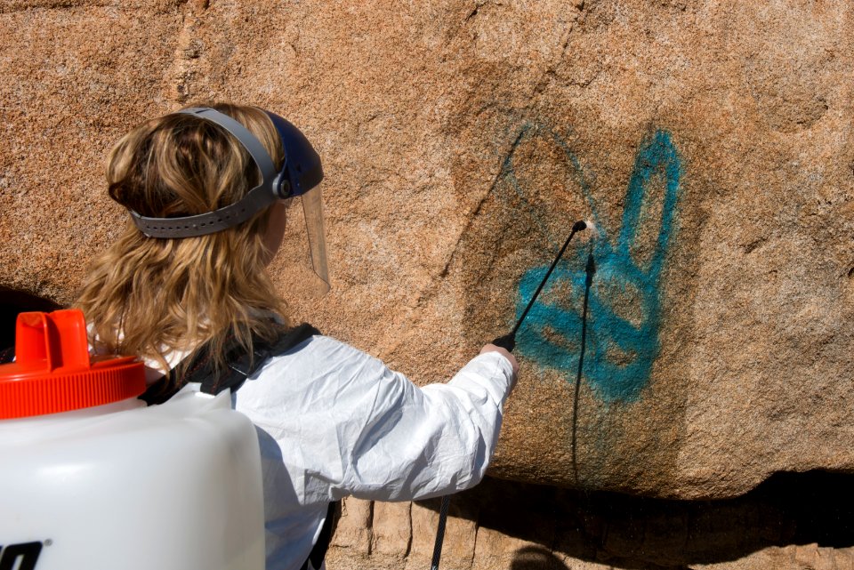 Spraying graffiti with water