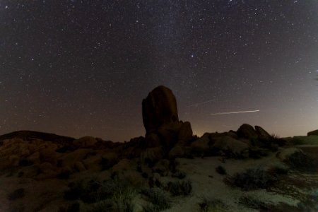 Night sky over desert landscape photo