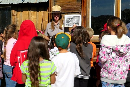 Kids on a Field Trip Eagerly Gather Around Ranger Sarah Jane Pepper at Keys Ranch
