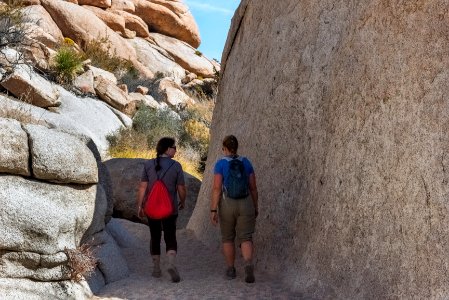 Tall boulder and hikers on Willow Hole trail