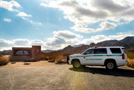 Park Ranger vehicle by the North Entrance Sign
