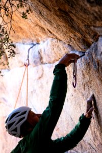 Climber steward placing gear at Gunsmoke photo