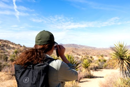 Hiker putting on sunglasses on Mastodon Peak Trail