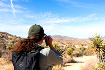 Hiker putting on sunglasses on Mastodon Peak Trail photo