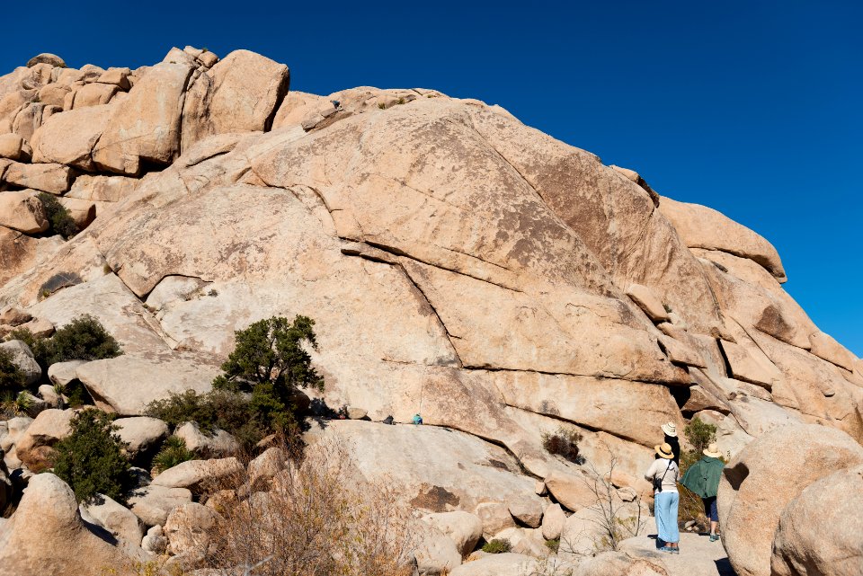 Visitors watching climbers near Barker Dam Trail