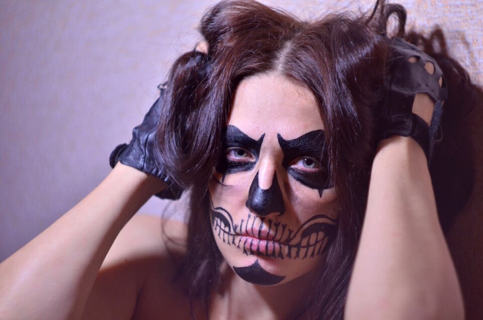Brunette drawing on the face makeup