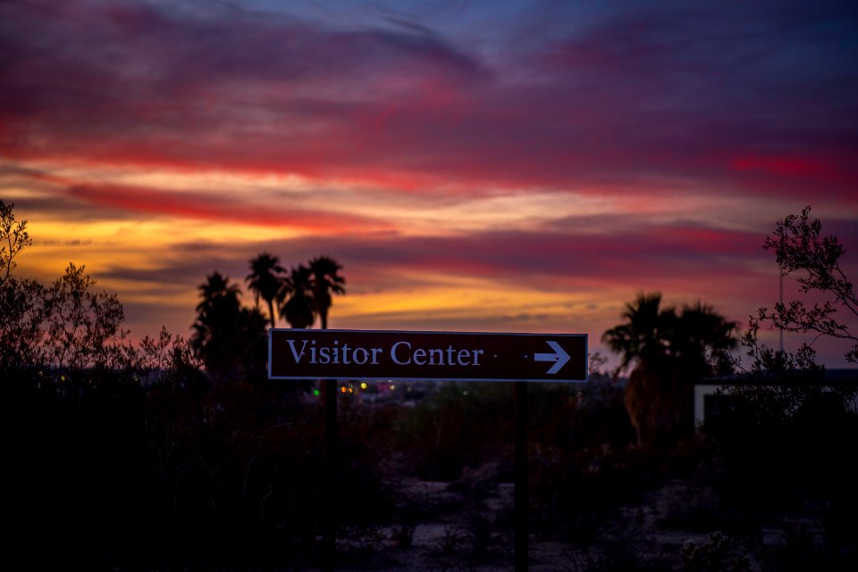 Oasis Visitor Center sign at sunset
