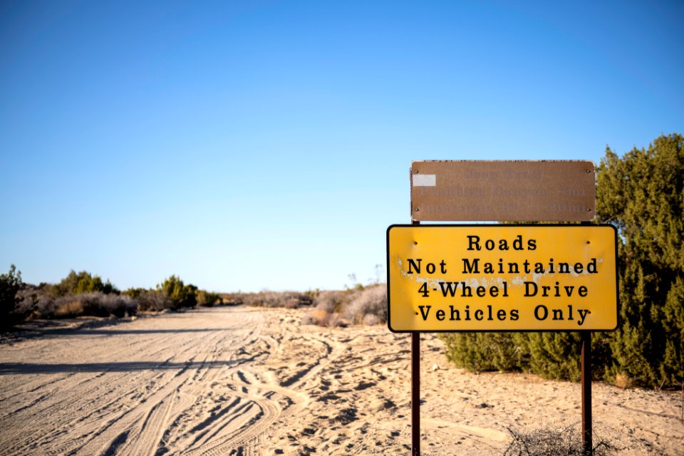 Pinkham Canyon Backcountry Route and Roads Not Maintained signs near Cottonwood photo