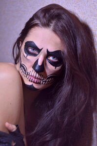 Brunette drawing on the face makeup