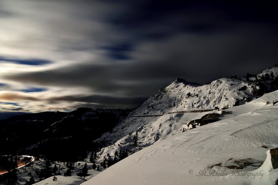 A full moon on the snow sheds