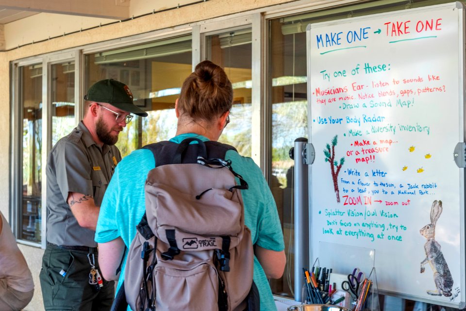 Park ranger talking to visitors at Oasis of Mara Visitor Center