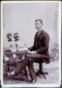 Portrait of a man with a penmanship manual