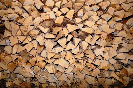Firewood wood for the fireplace stacked photo