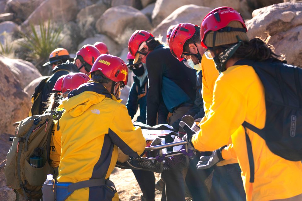 Joshua Tree Search and Rescue team members training carrying a litter