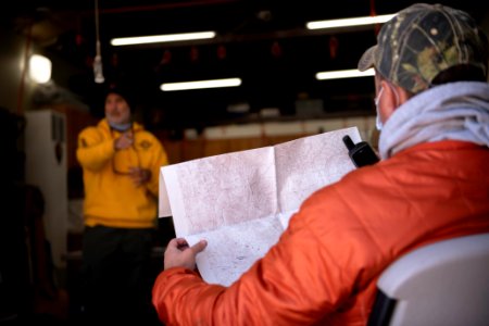 Joshua Tree Search and Rescue team members training on GPS and topographical map reading
