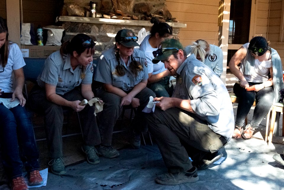 Park staff learning flintknapping techniques